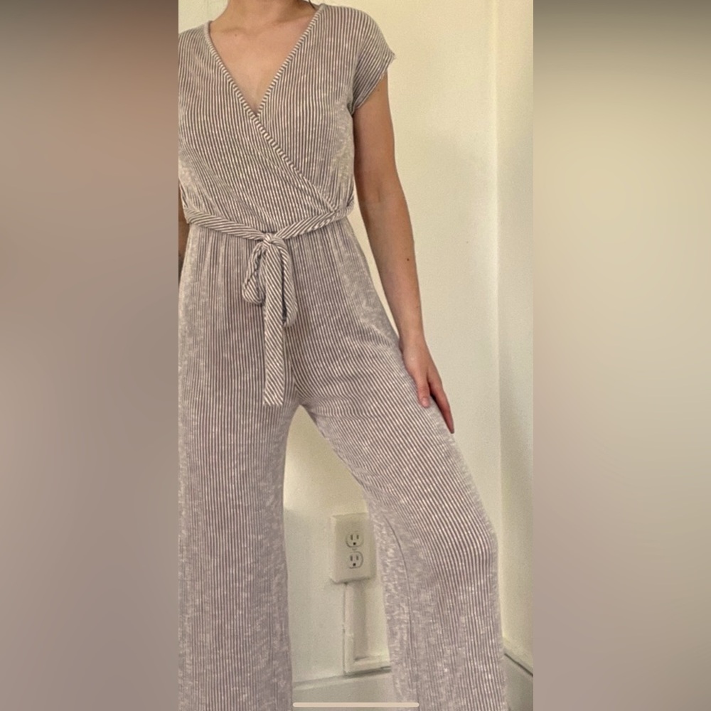 Caution to the Wind v-neck jumpsuit with tie. Comfortable and flattering.